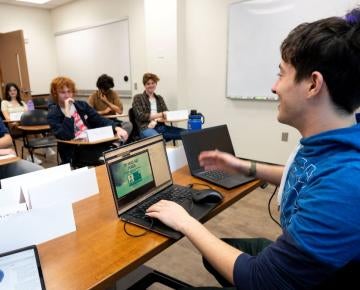 Student presents to a classroom of peers