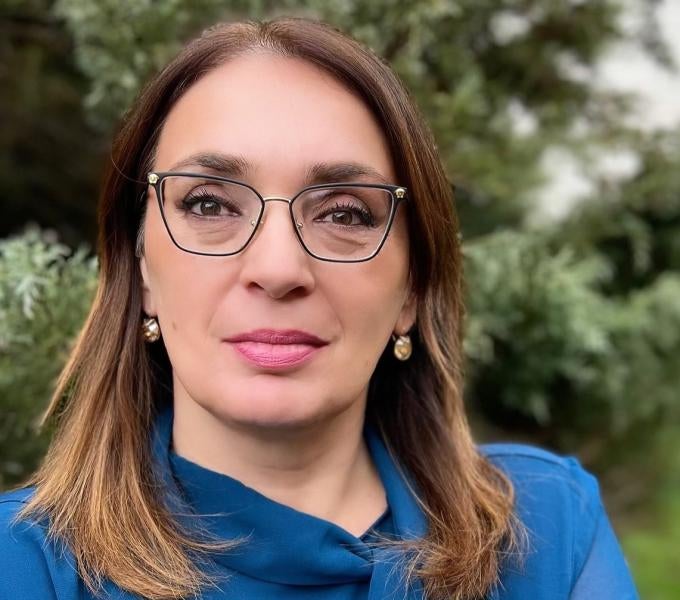 Ljiljana Duraskovic, Woman with brown hair and wireframed glasses with blue blouse